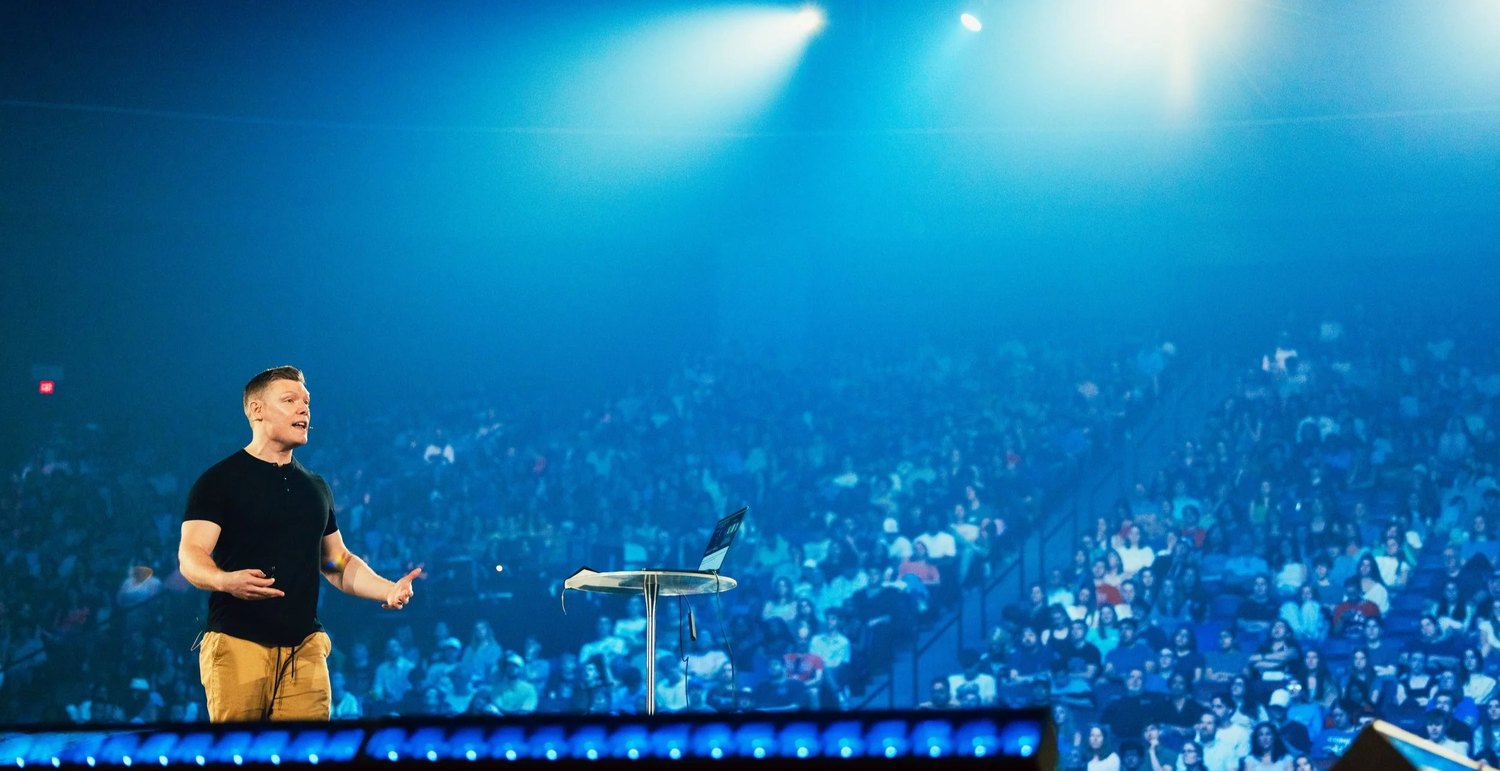 Wesley Huff speaking on stage